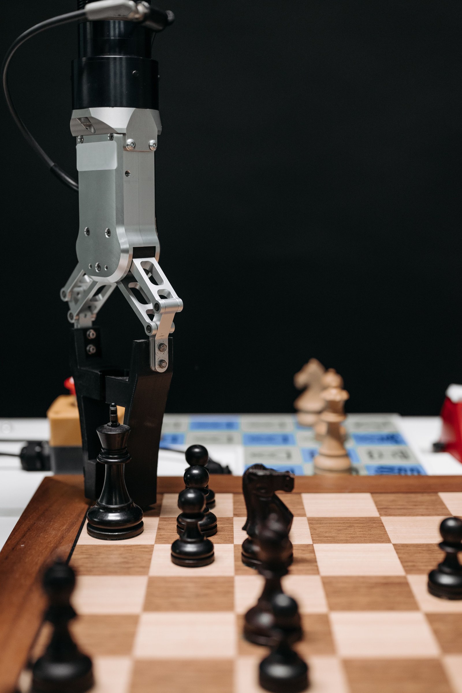 Robotic arm making a precise move on a chessboard